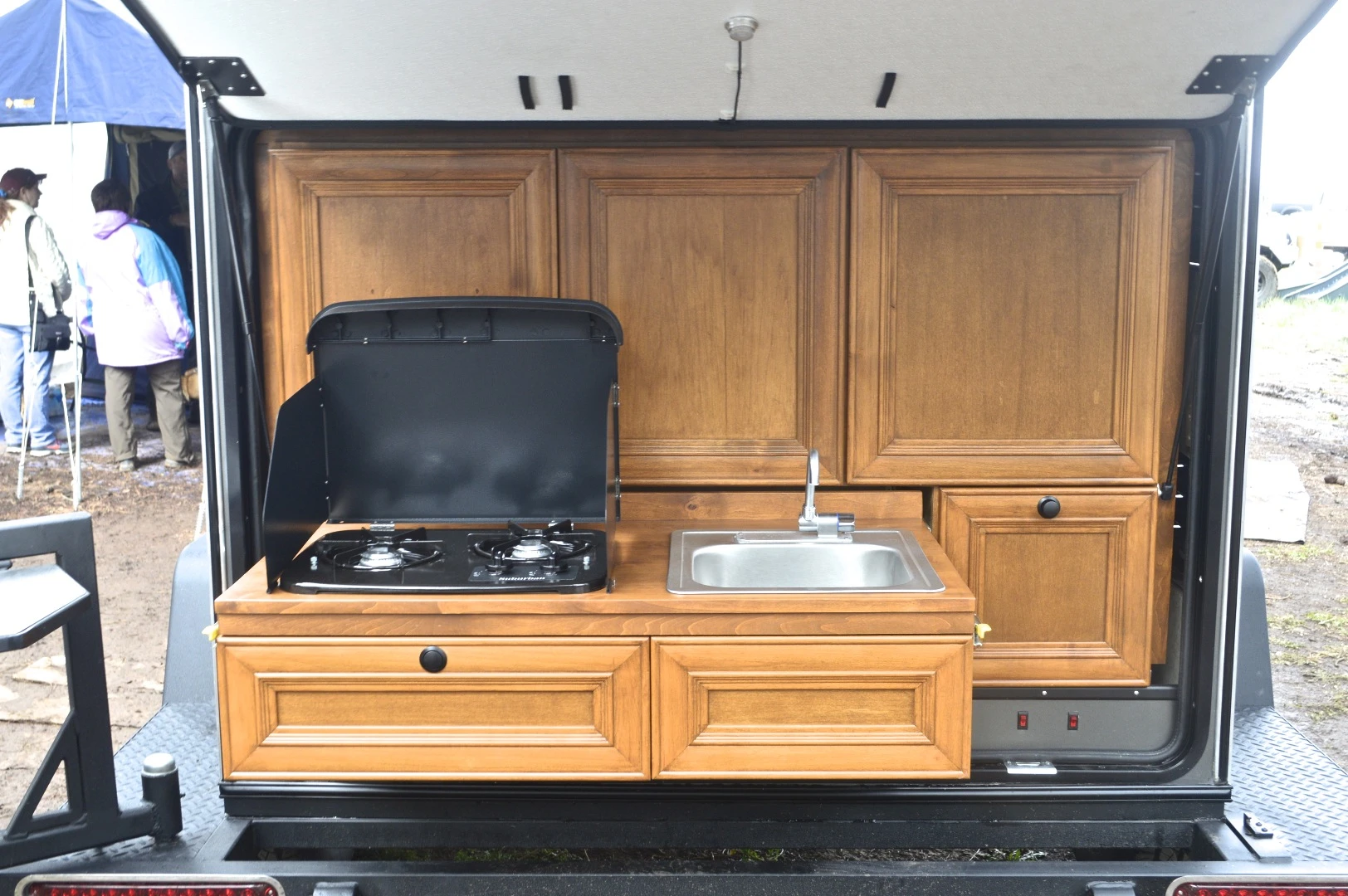 The Gobi includes a slide-out kitchen area with sink and cooktop.