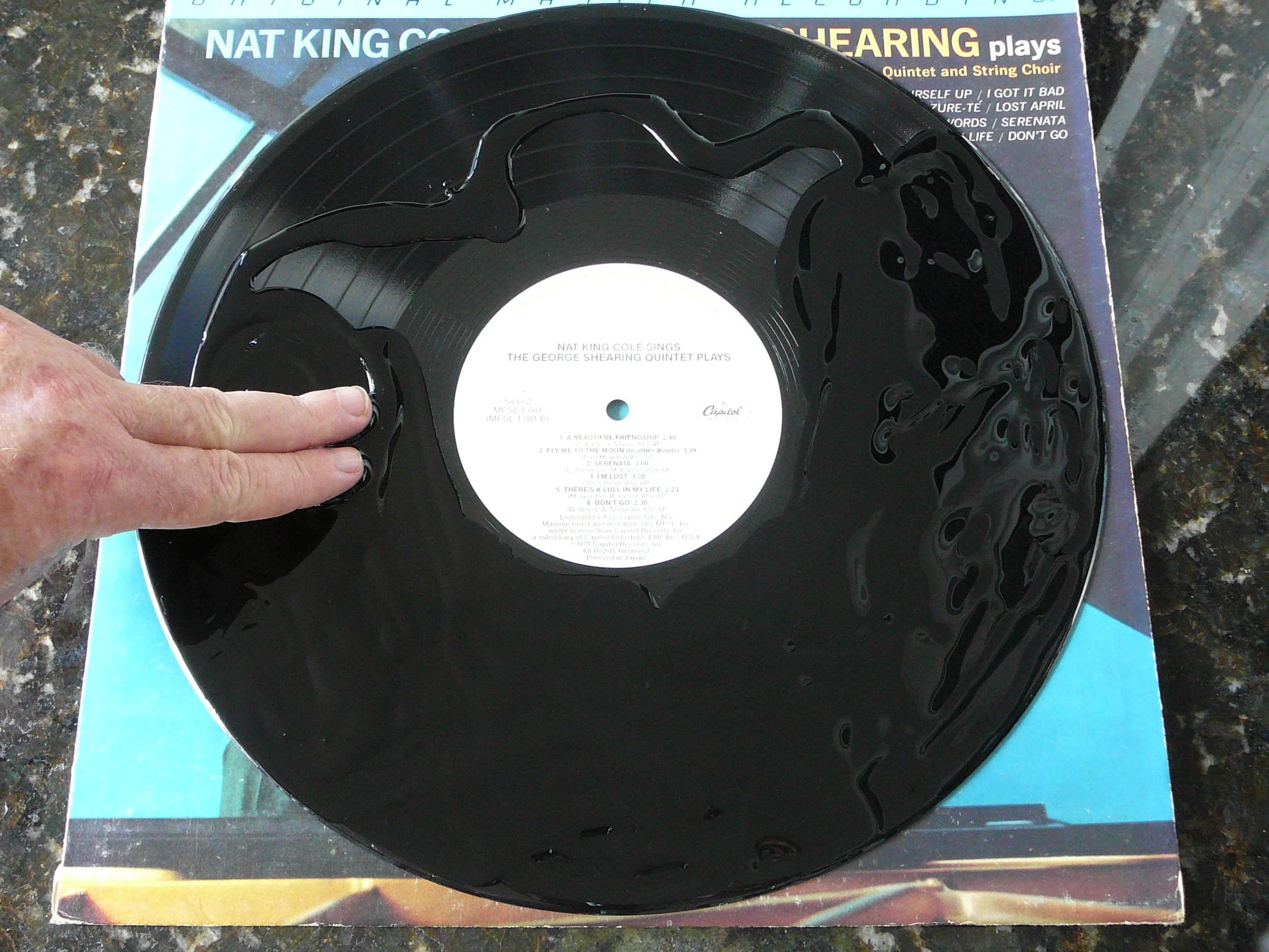 Spreading Record Revirginizer onto an LP