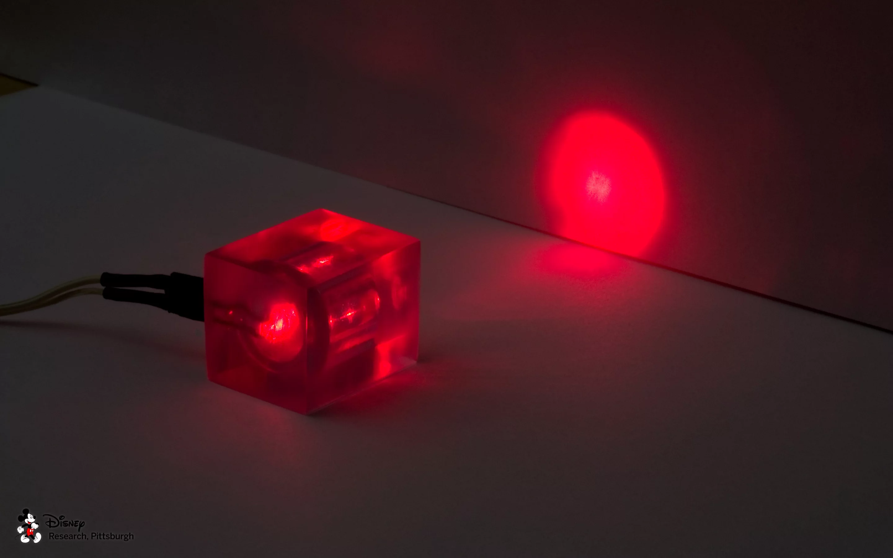 An LED embedded in a 3D printed lens to focus light