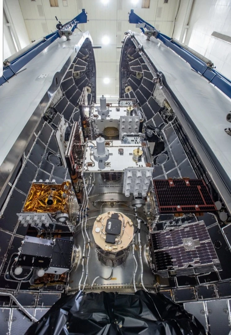 Payloads are packed into the Falcon Heavy nosecone ahead of today's launch