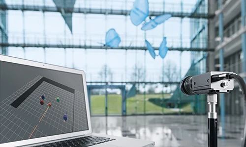 Each flapping robot has two IR markers on its torso and is tracked by the system, with positional data sent to a master computer for processing