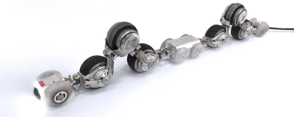 Depending on what's required, THESBOT takes on a sort of zig-zag shape, so that only certain dedicated wheels make contact with the pipe walls