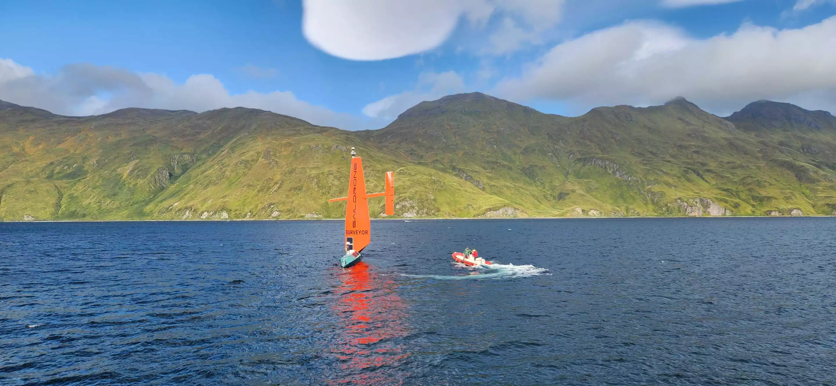 The Saildrone SD 1200 uncrewed surface vessel was remotely piloted from shore during the Alaska mission, with at-sea operations managed by the University of New Hampshire's Center for Coastal and Ocean Mapping team and NOAA Ocean Exploration staff