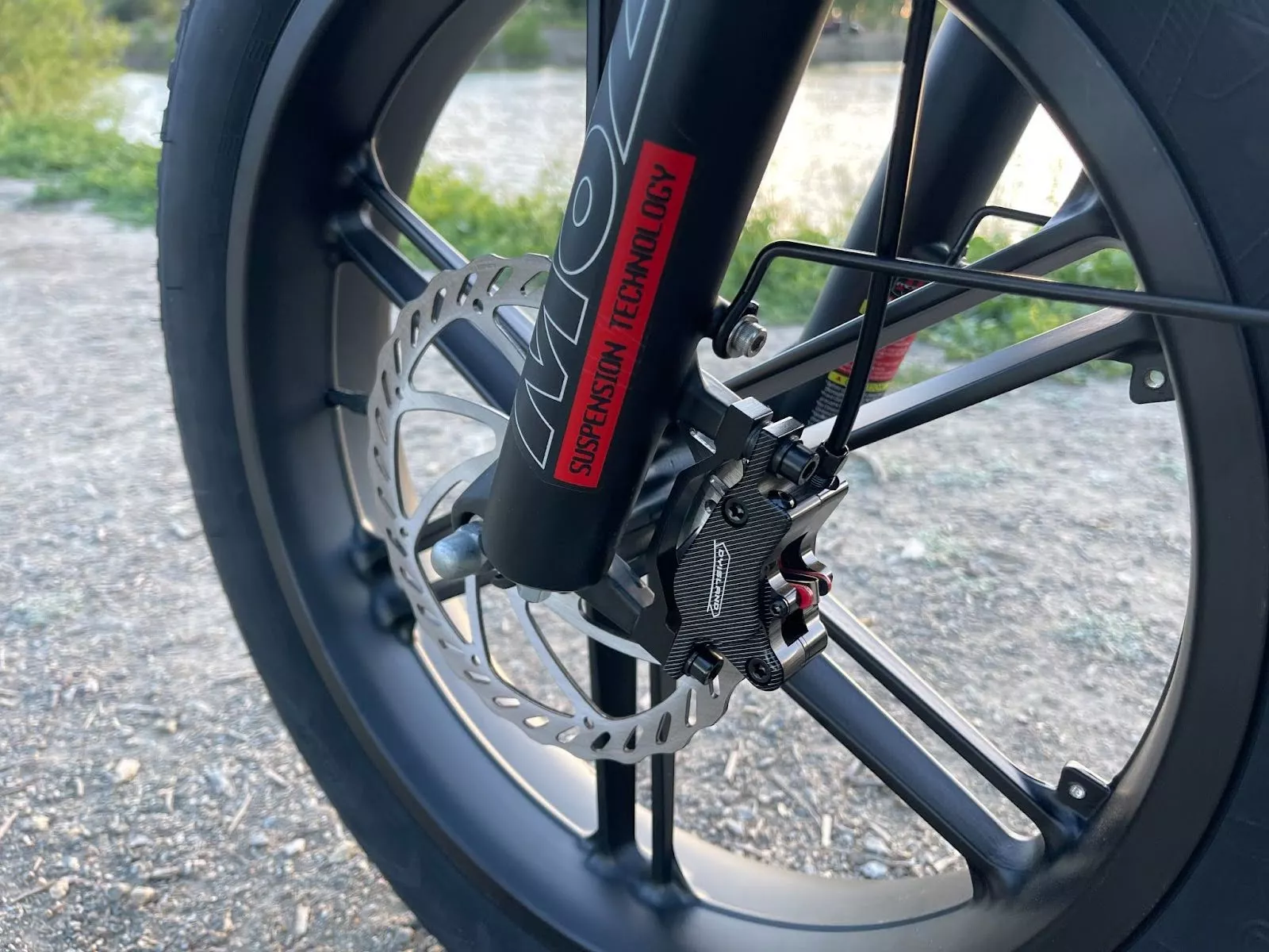 The front fork works with fat tires to give you a cushioned ride.