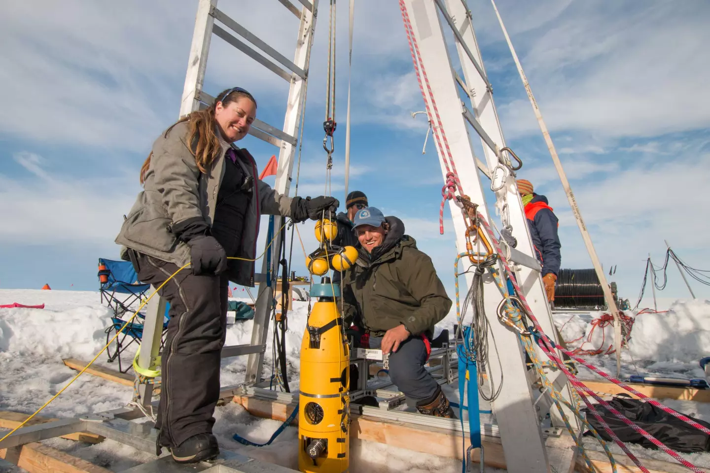ITGC researchers Britney Schmidt (left) and Andy Mullen retrieve the robotic submarine Icefin after its last dive to the seafloor foundations of Thwaites Glacier