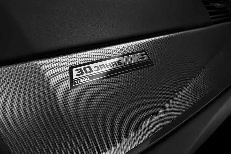 A badge bearing "30 Jahre M5" is integrated into the interior trim