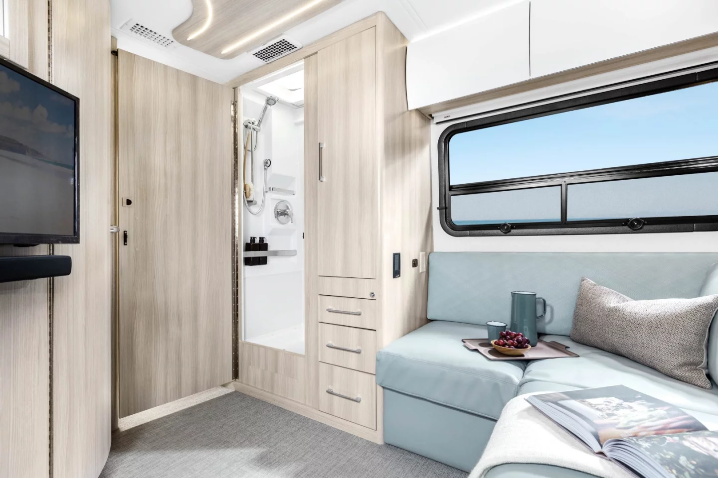 The shower compartment is across the hall from the toilet room