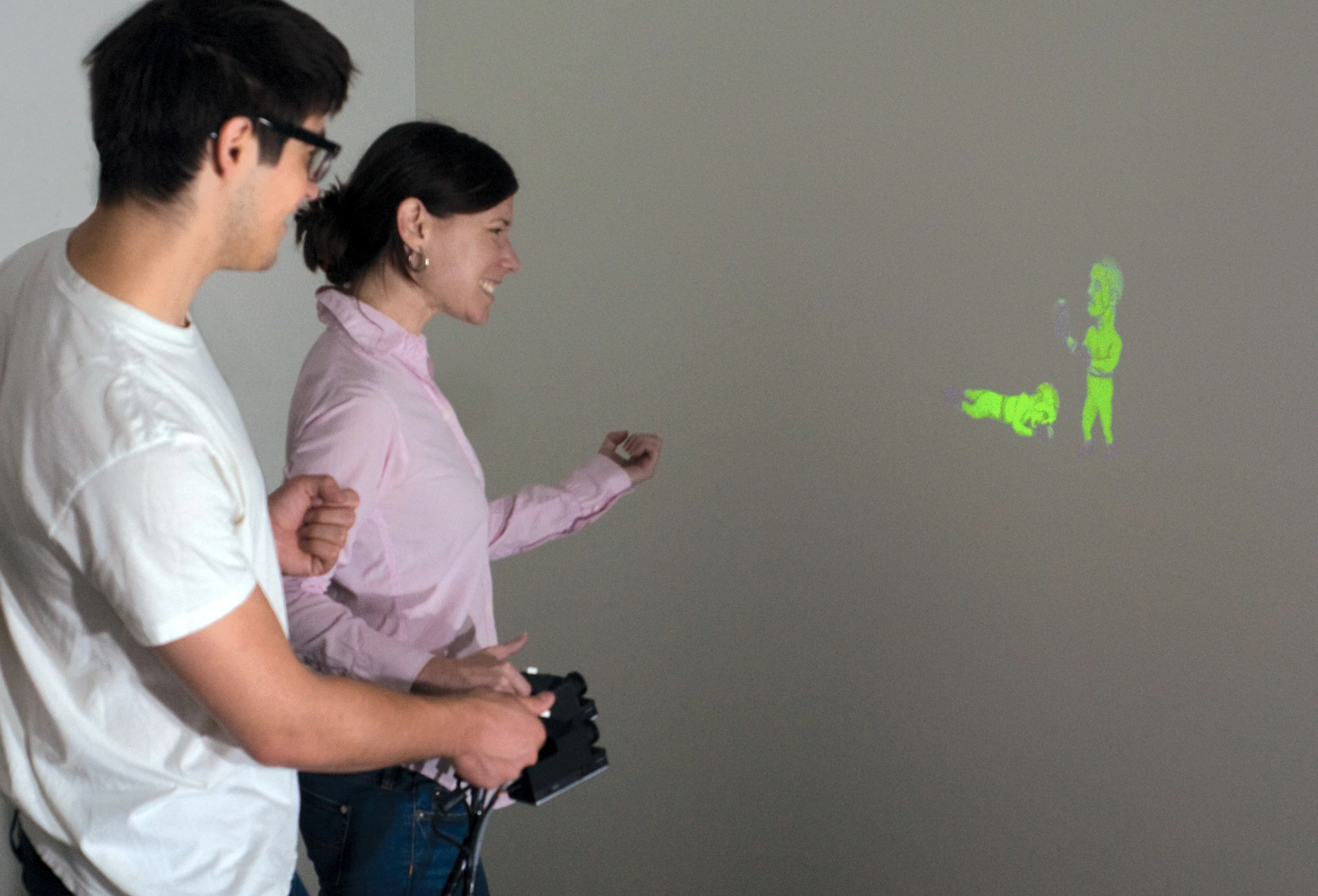 The prototype SidebySide system allows animated images from two separate pico projectors to interact with one another (Photo: Disney Research)