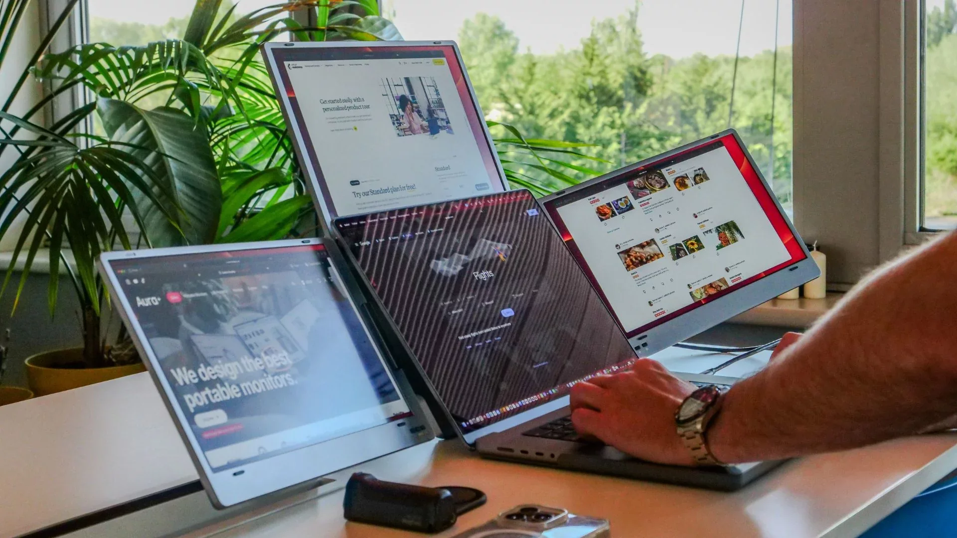 Transform your mobile workspace into an immersive quad-screen productivity hub with the Triple Boost 14" Pro