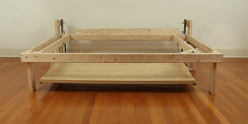 The finished wooden prototype has a 59-inch wide and 29.5-inch deep Vika Amon table top from Ikea and a bed frame measuring 24.5 x 78.5 x 57.5 inches