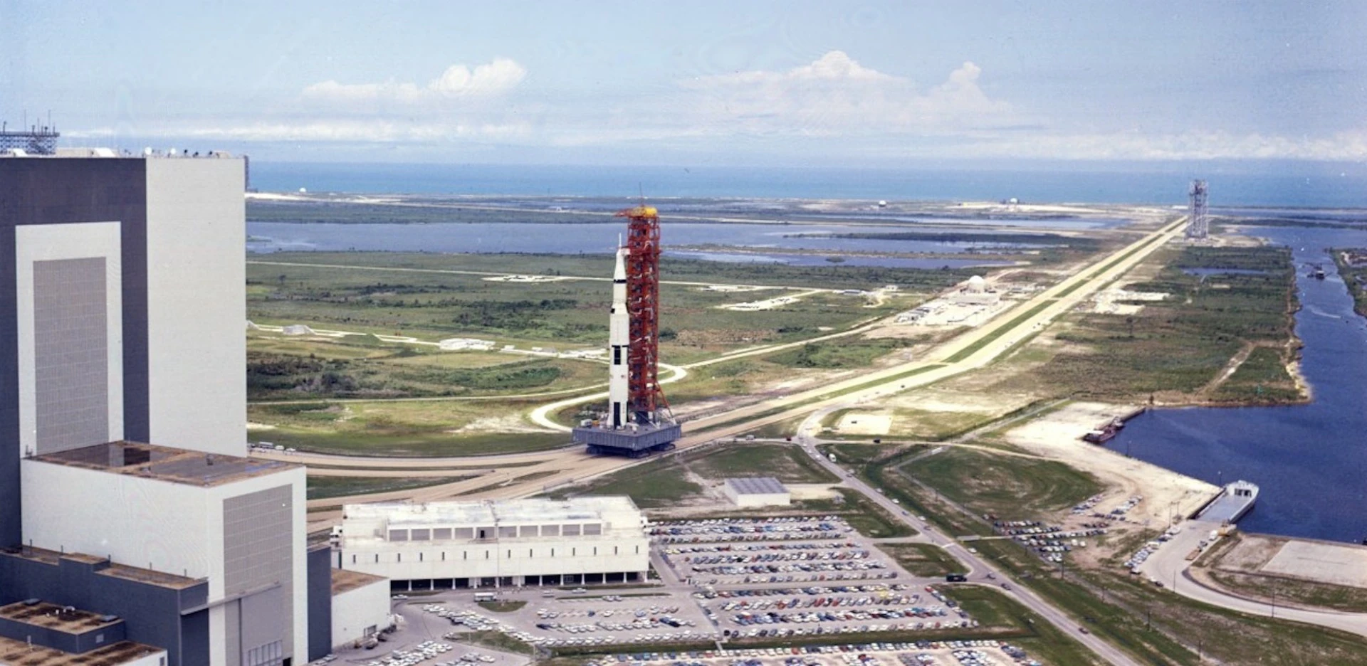 Saturn V SA-506, the space vehicle for the first lunar landing mission, is rolled down the 3.5 mile crawlerway to Launch Complex 39-A