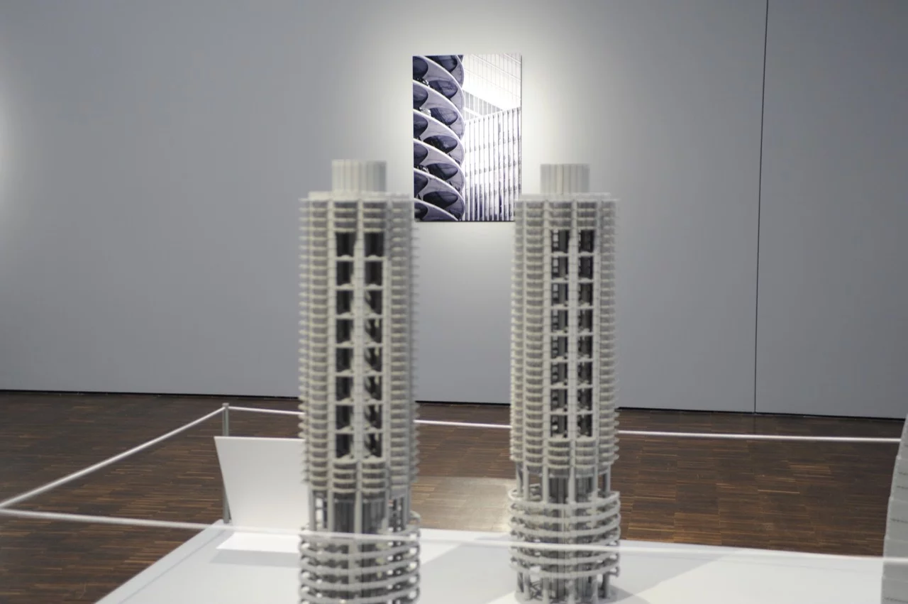 The exhibition also features accompanying black and white photographs by J. Hunt Harris II