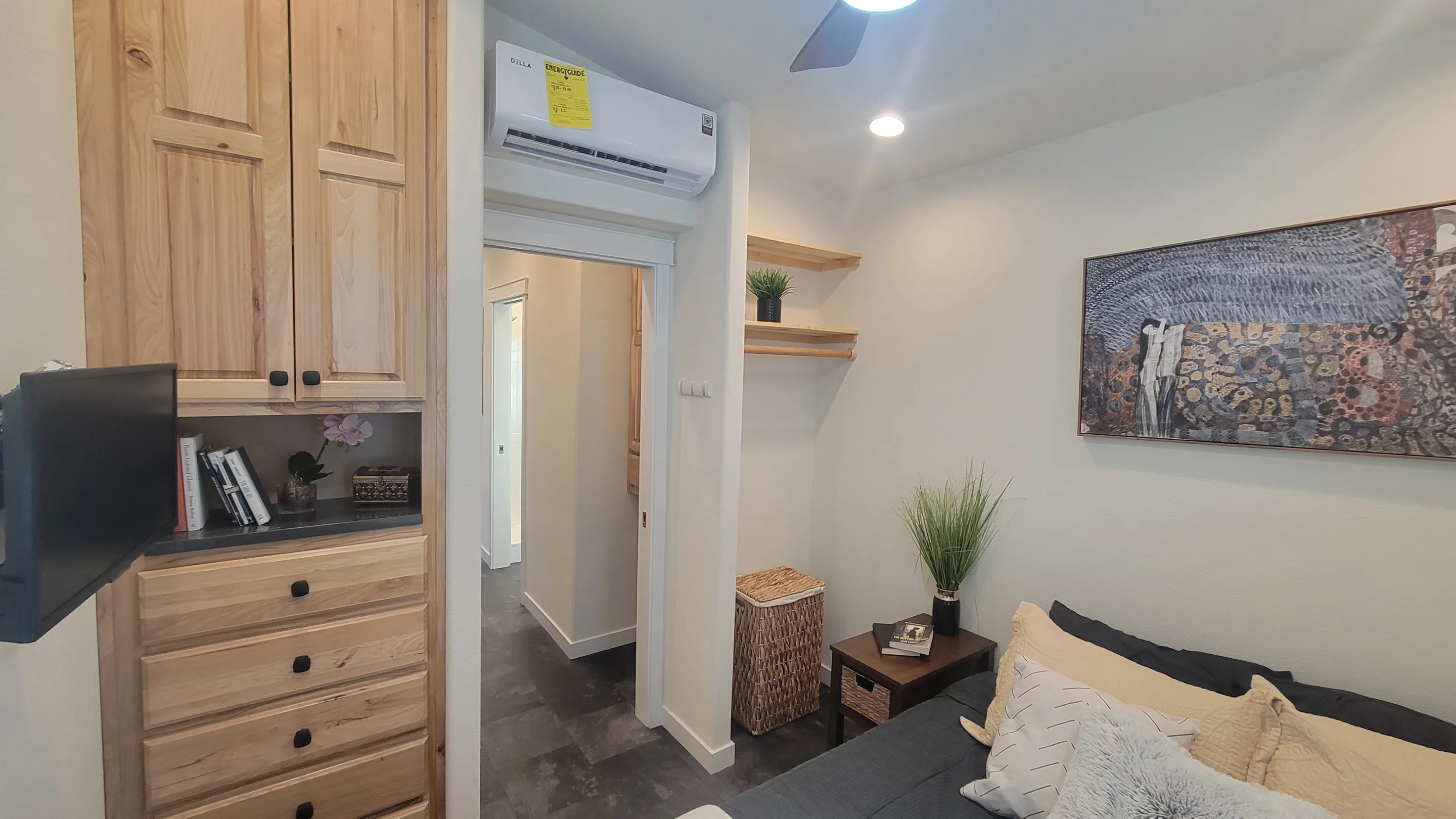 The Olivia Summit's master bedroom has a TV, a double bed, and quite a lot of storage space