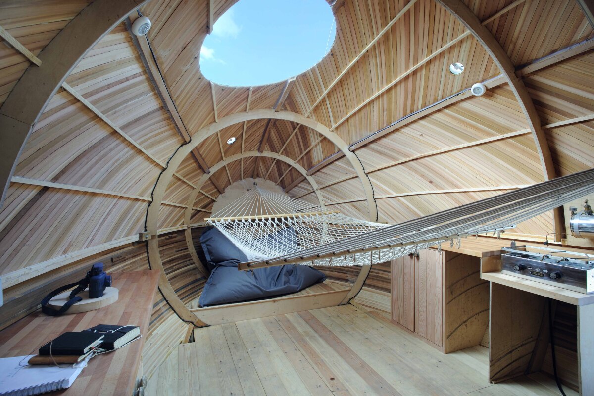 The interior contains a desk area, hammock, and kitchen, which itself sports a paraffin stove and sink (Photo: Nigel Rigden)