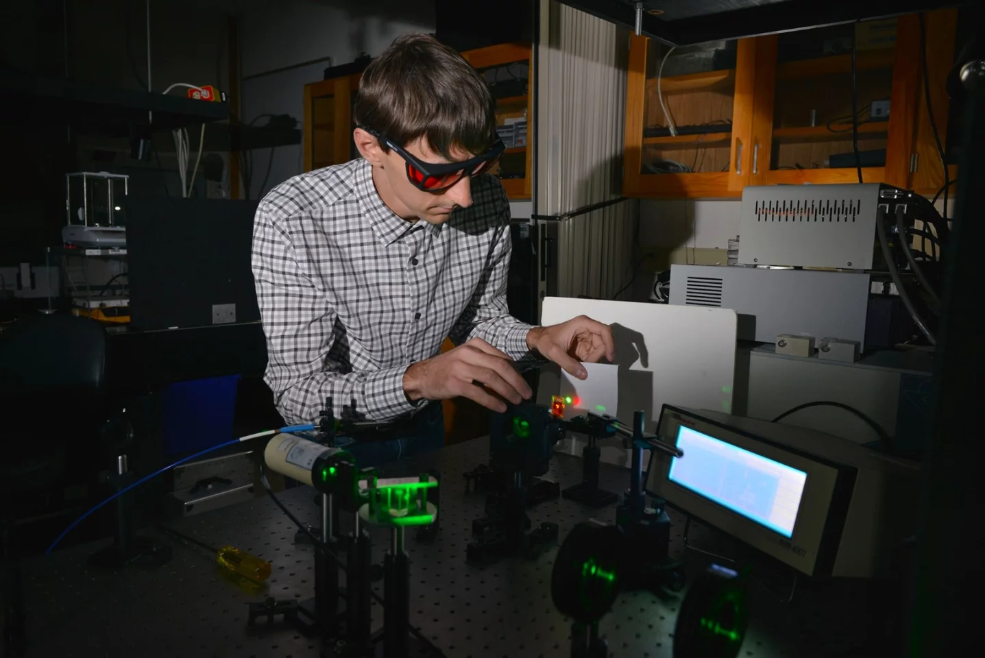 Kent State University chemical physics graduate student Andrii Varanytsia demonstrates laser emission with a liquid crystal elastomer