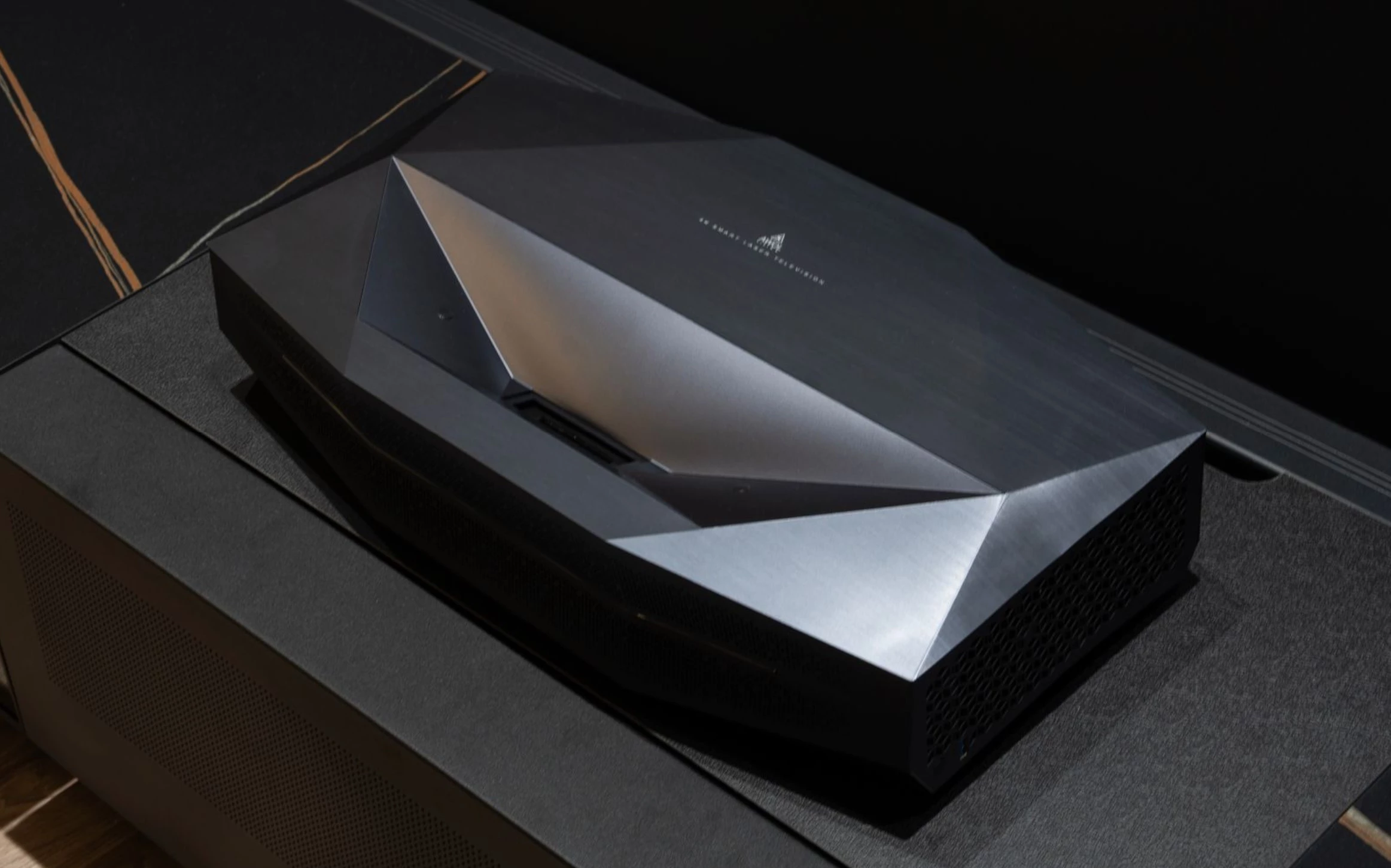 The PixelLock technology combines optical, mechanical and digital elements to compensate for "lens element tolerances, temperature-induced expansion, micro-warping of UST angles, reflective path inconsistencies, and DLP sequencing artifacts." That's said to result in uniformly sharp, color-rich 4K visuals "even at extreme screen sizes up to 200 inches"