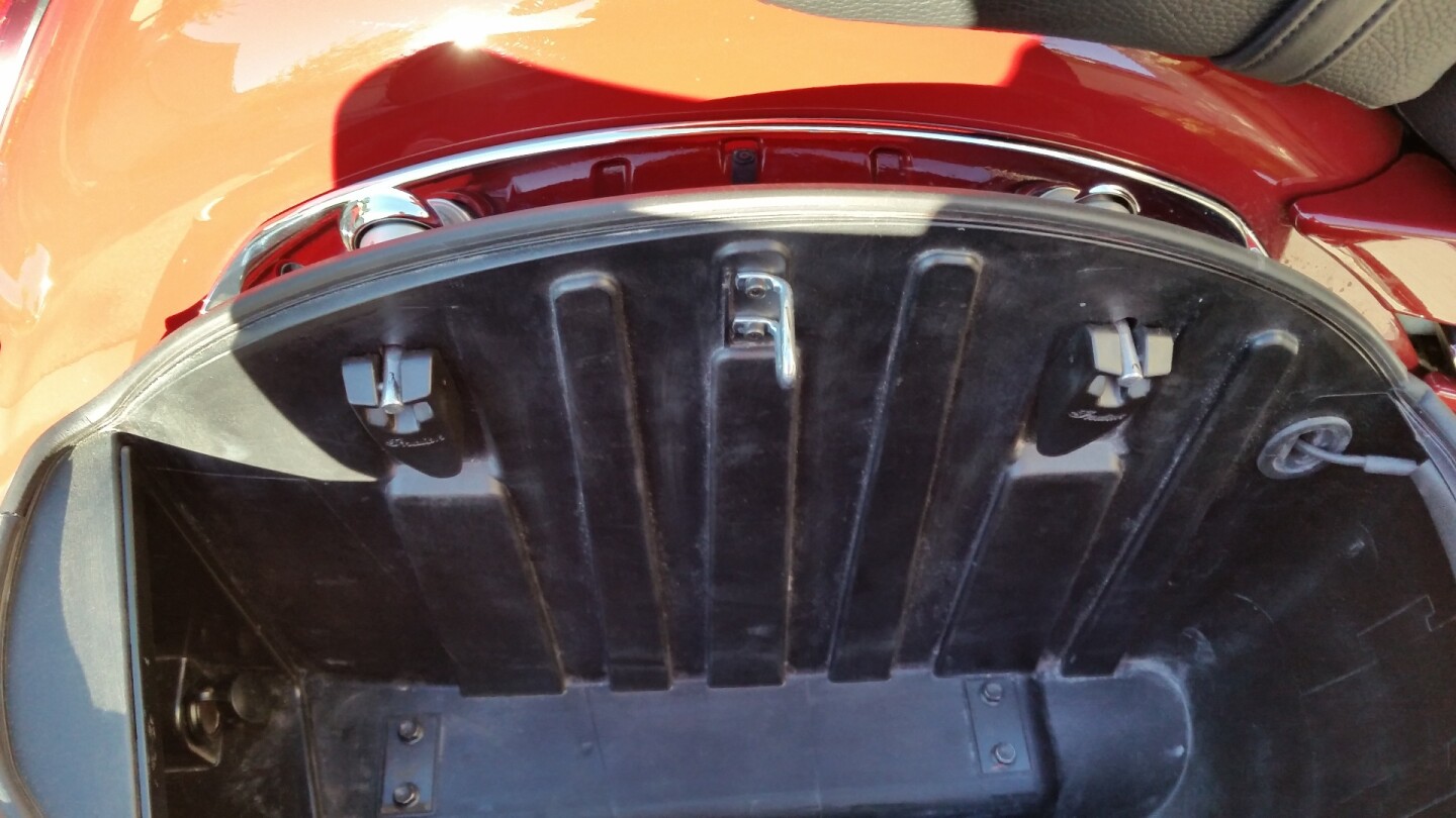 Inside the side bag you can see the two latches that hold it in place