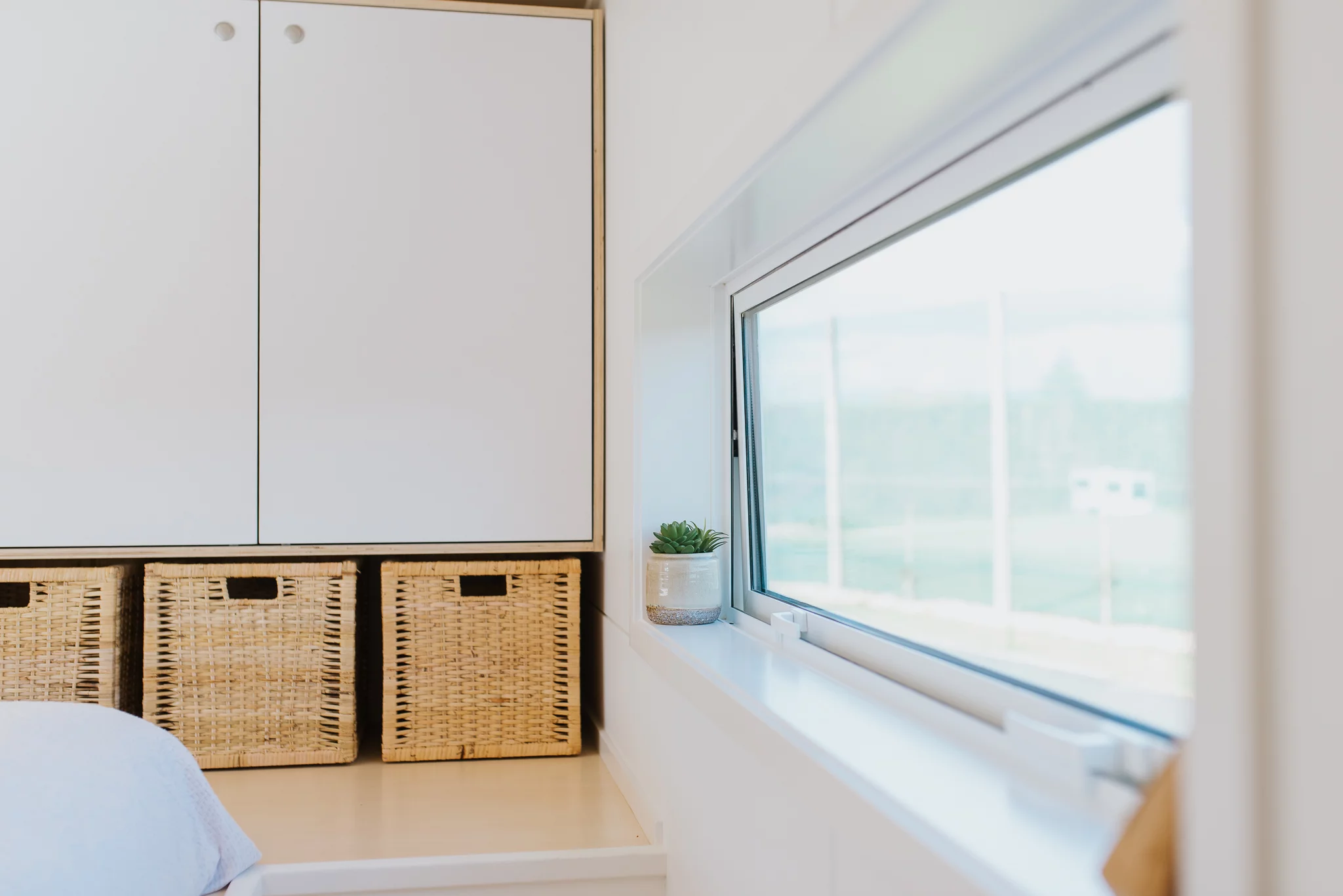 The Bitser Tiny House's bedroom includes generous storage space in the form of wardrobes and storage boxes