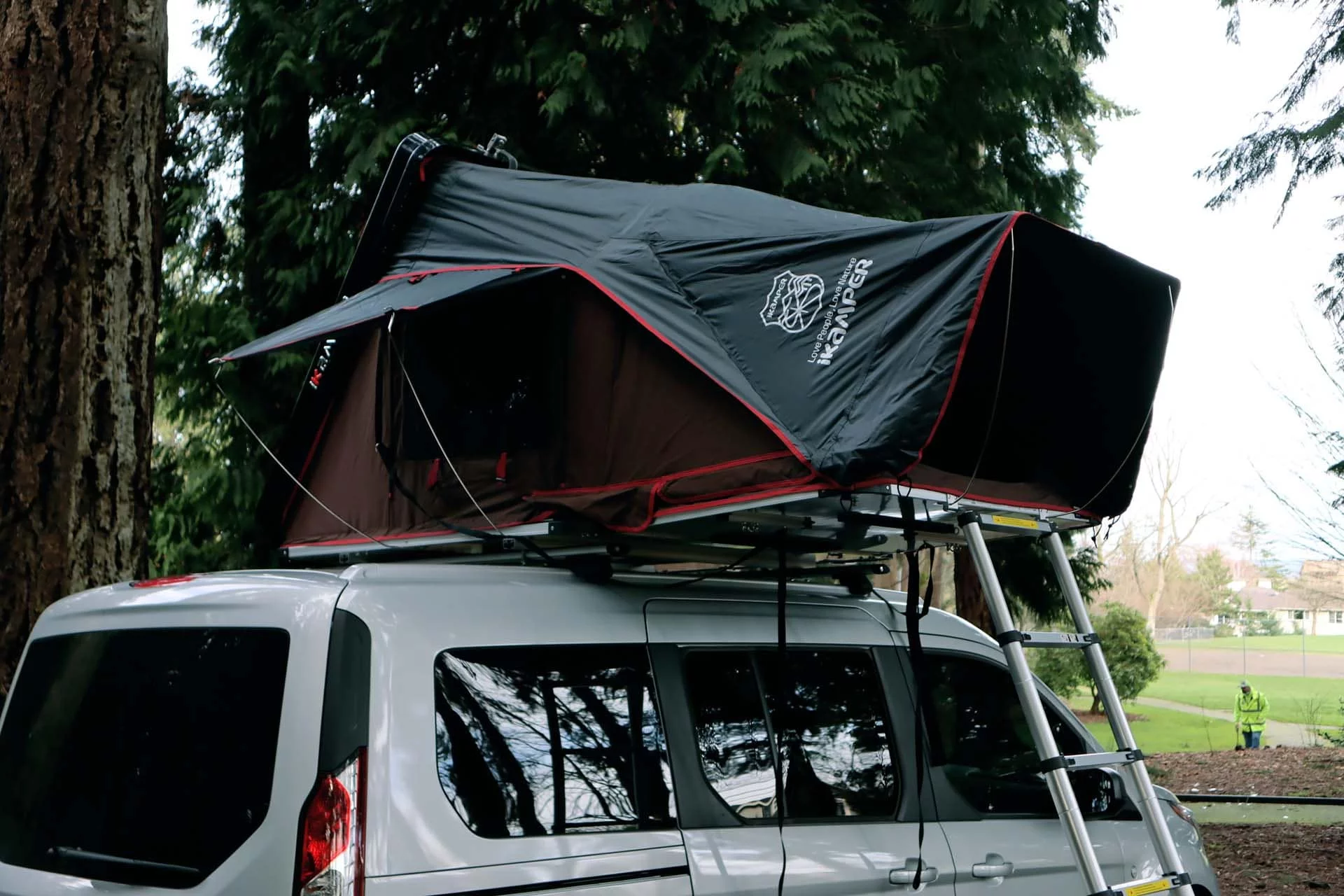 The iKamper Skycamp Mini rooftop tent adds two extra sleeping births, creating a camper van that seats and sleeps four