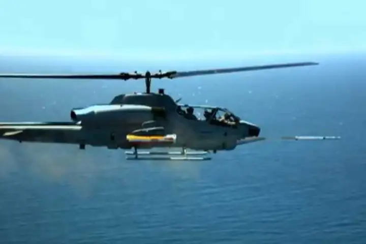 Test firing of an LCITS rocket from an AH-1 Cobra helicopter