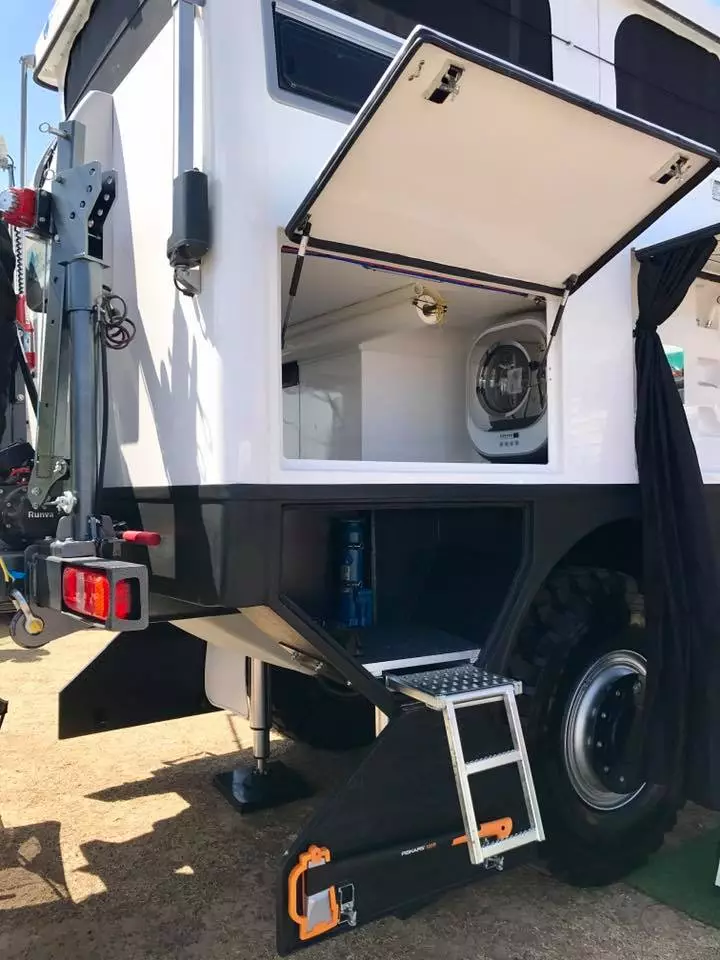 A peek inside the XPR440's rear storage area reveals the compact washing machine, a nice luxury when way out in the hinterlands, if ever there was one