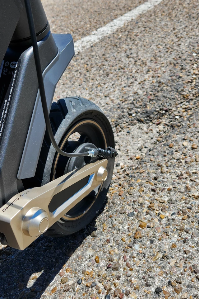 It might not look like much in the photo, but I hit that pot hole at about 15 mph and barely noticed. It would have been a tank-slapper for sure on any other scooter I've ridden
