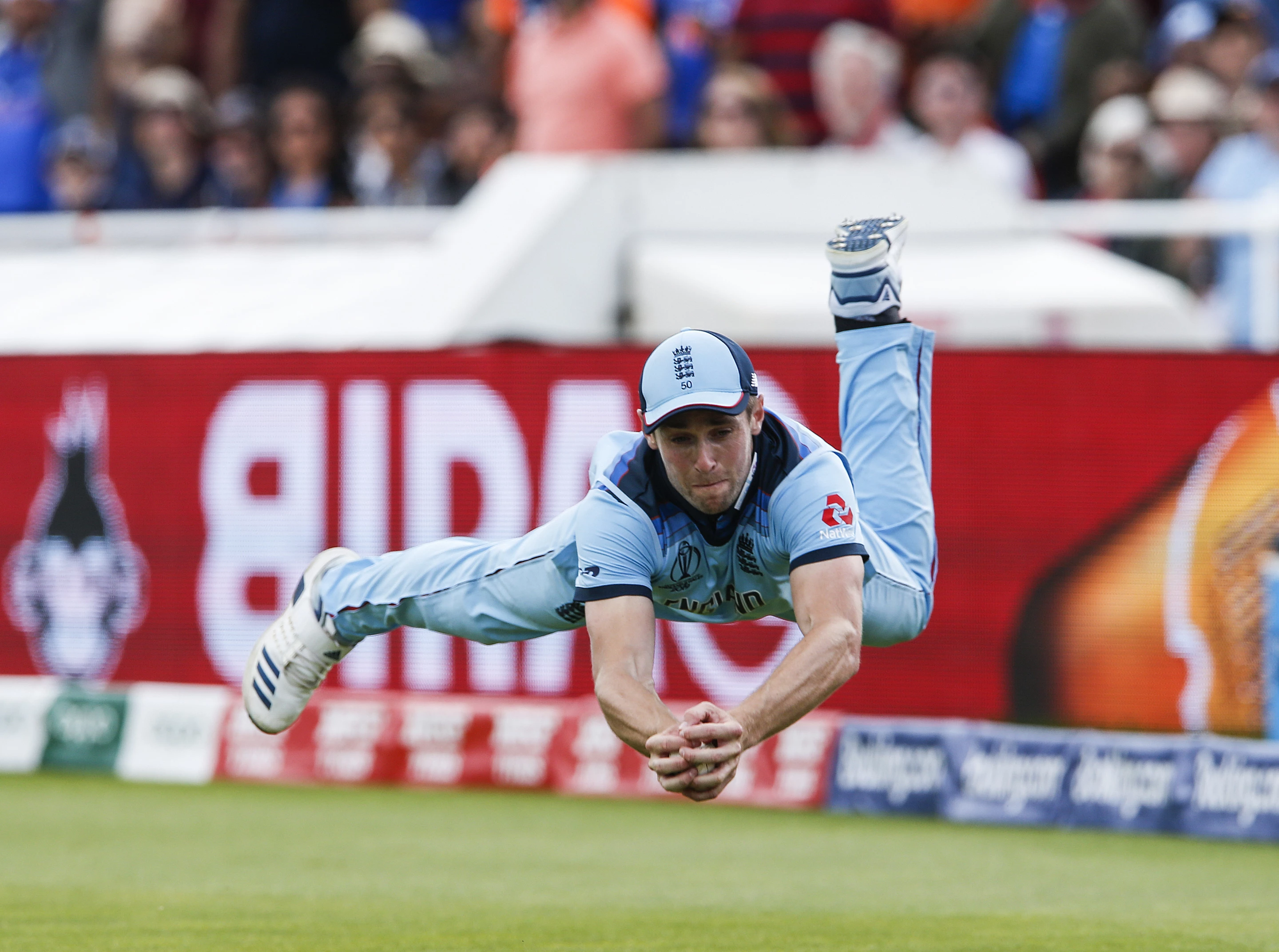Gold, Focus. Chris Woakes of England catches Rishabh Pant of India off the bowling of Liam Plunkett during the Cricket World Cup match between England and India at Edgbaston, Birmingham