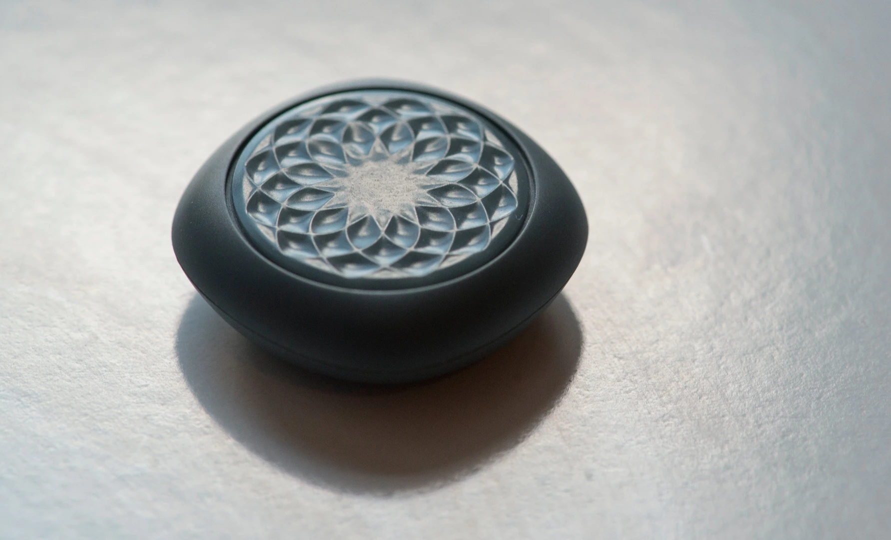 The Jawbone UP Move fitness tracker features decorative patterns on the front