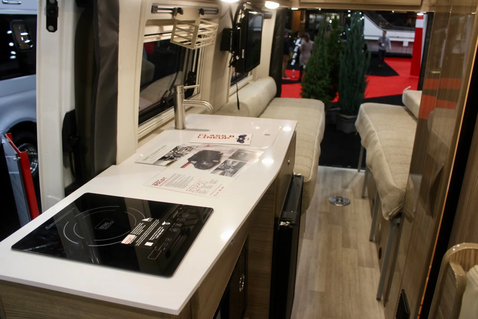 A look at the Q70 BL floor plan, which includes a front dining area, central kitchen and bathroom, and rear sofa/flex bed