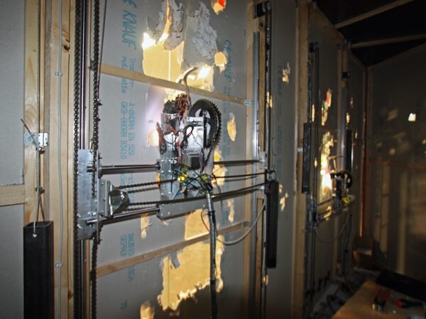 The robots share the wall space and the mechanism for moving around