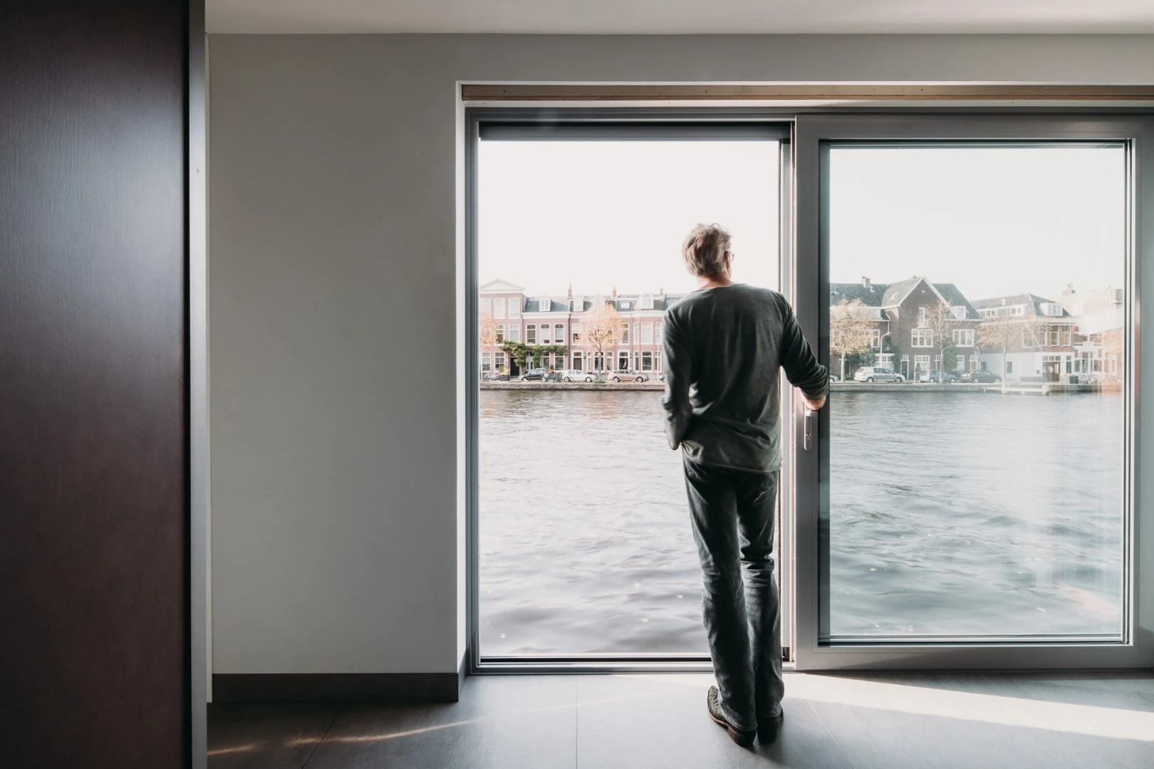 The floating home is designed to offer the occupants privacy while also capitalizing on views across the river