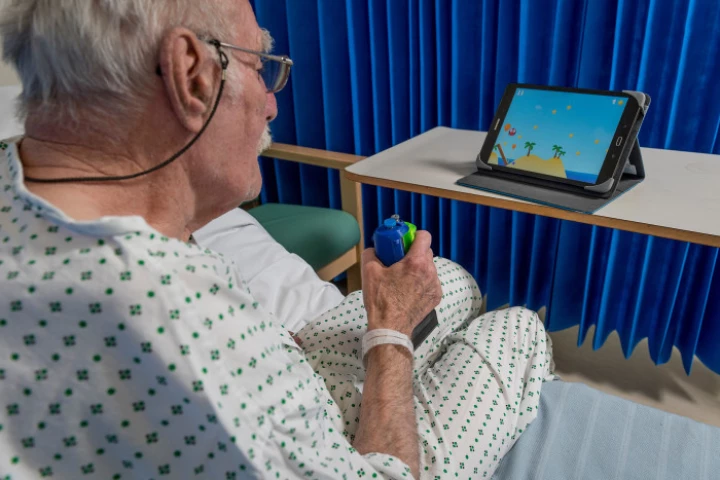 A stroke patient tries out the GripAble device
