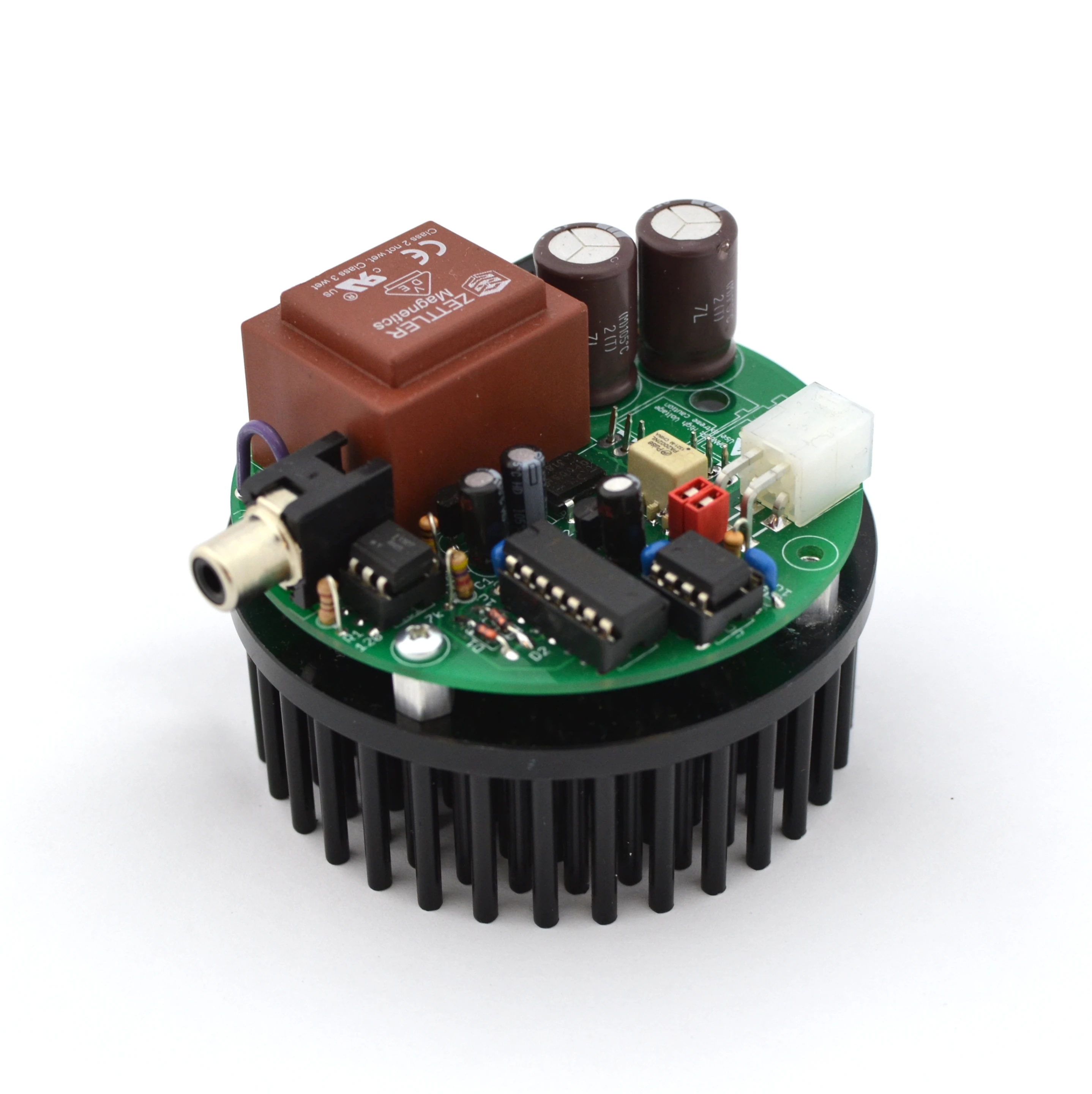 The tinyTesla's 3-inch circular control board sits atop a hedgehog heat sink