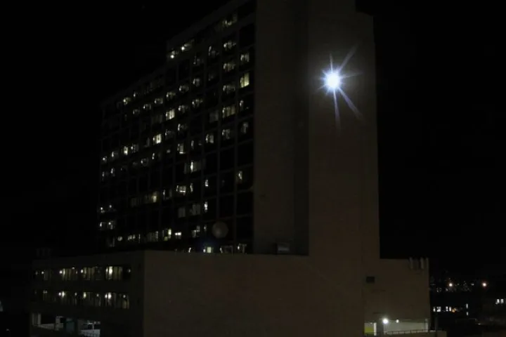 Adam Frank's SUNLIGHT at its peak, on the side of Denver's Minoru Yasui Building