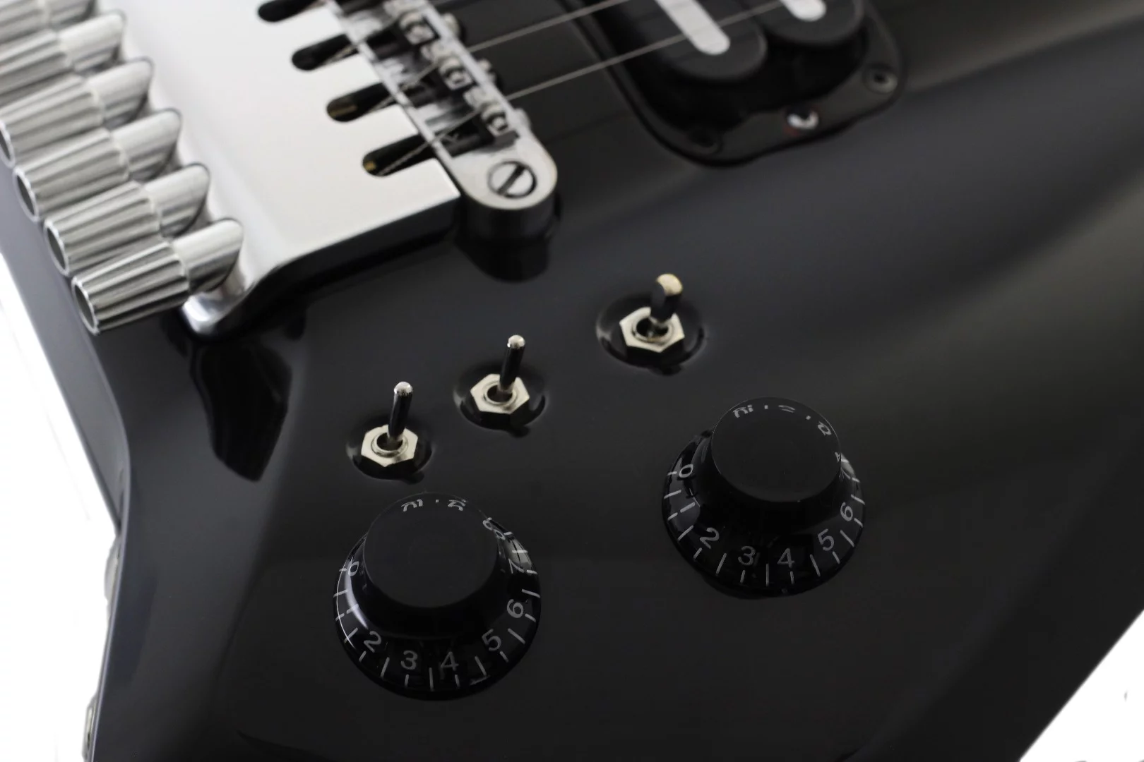Pickup selection is undertaken using a three-position toggle switch, and there are two coil tap switches for changing from humbucker to single coil