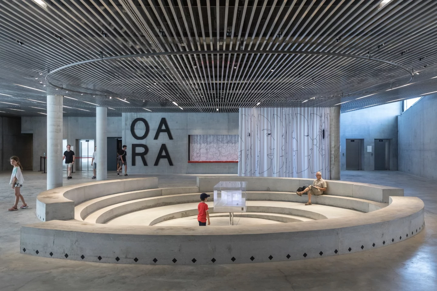 Visitors to MÉCA enter into the lobby, which includes a spiral seating area