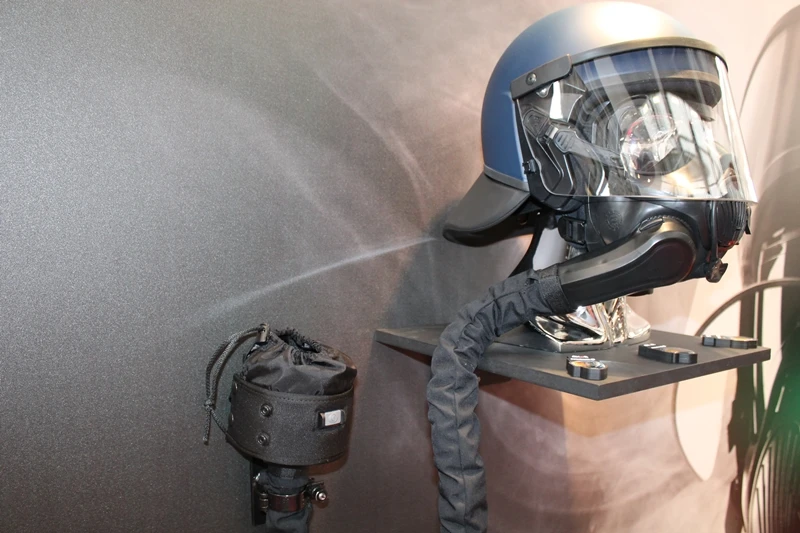 The respirator can be put on without having to remove the helmet