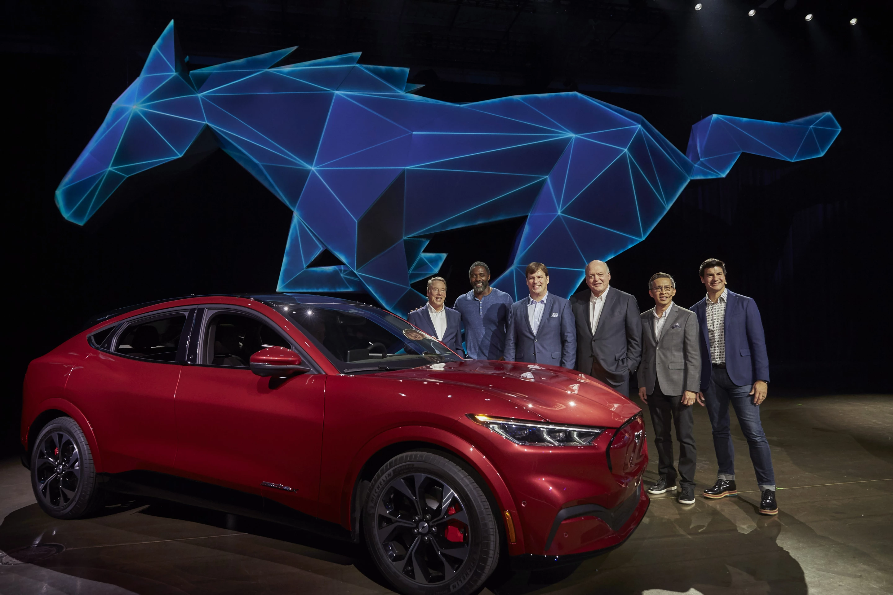 From left, Ford Motor Company Executive Chairman Bill Ford, actor Idris Elba, Ford President of New Businesses, Technology and Strategy Jim Farley, Ford Motor Co. President and CEO Jim Hackett, Ford Chief Product Development Officer Hau-Thai Tang and Ford Enterprise Product Line Director for Global Electrification Ted Cannis at the reveal of the all-electric Ford Mustang Mach-E SUV