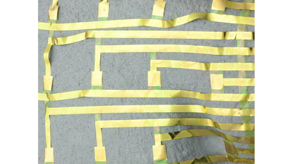 Neural electrode array wrapped onto a model of the brain after dissolution of a thin, supporting base of silk (Image: C. Conway and J. Rogers, Beckman Institute)