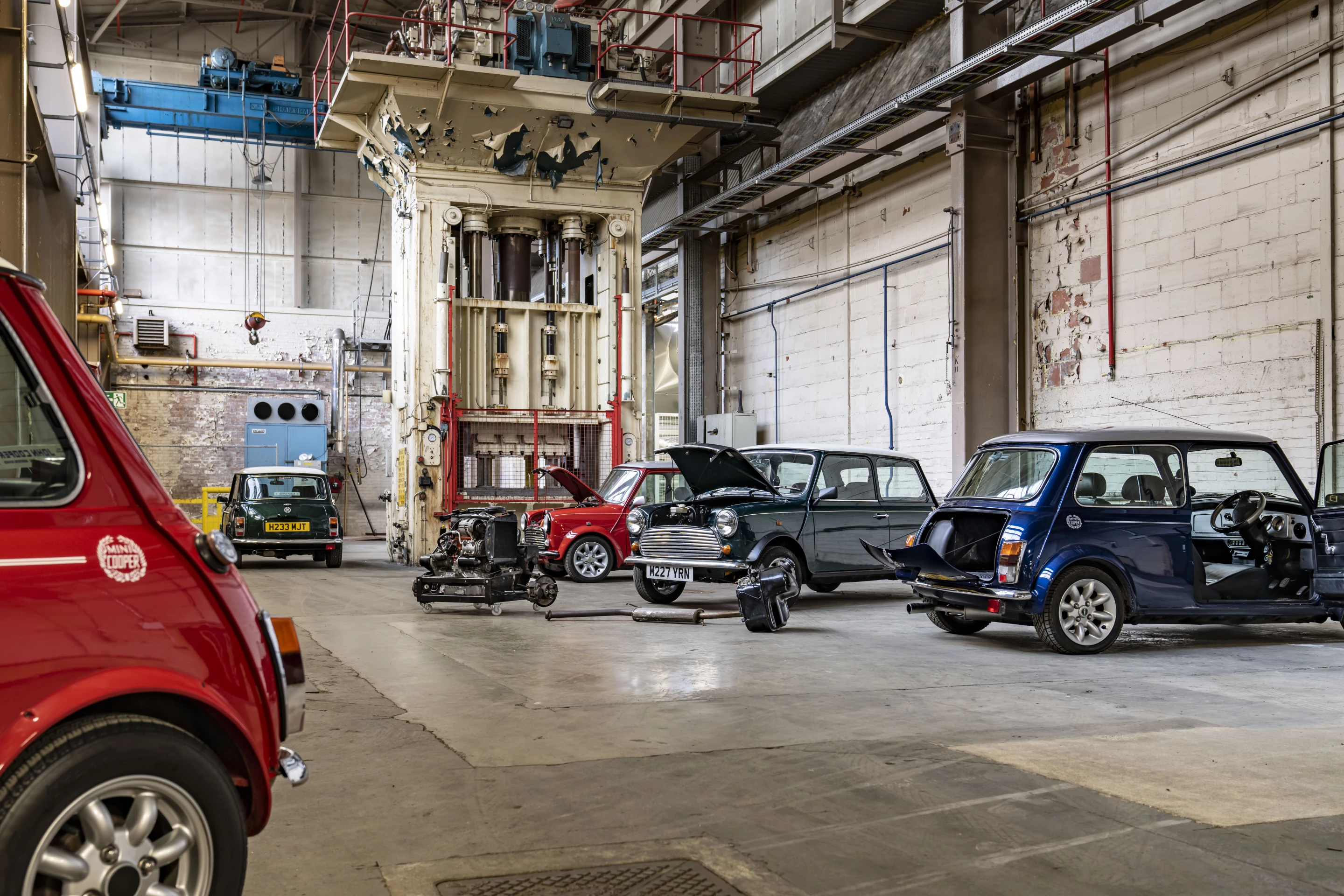 The original petrol engine from the classic Mini is removed, marked and stored in case the owner wishes to restore the vehicle to its original condition at a later date
