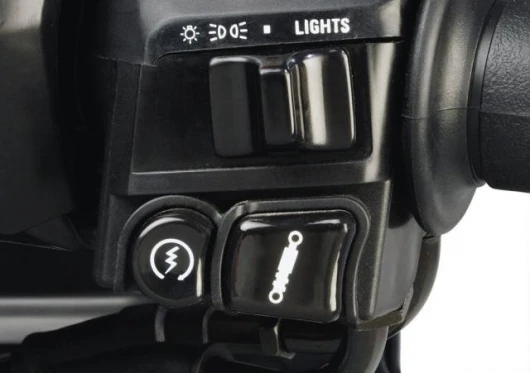 Electronic suspension adjustment button sits right next to the starter button.