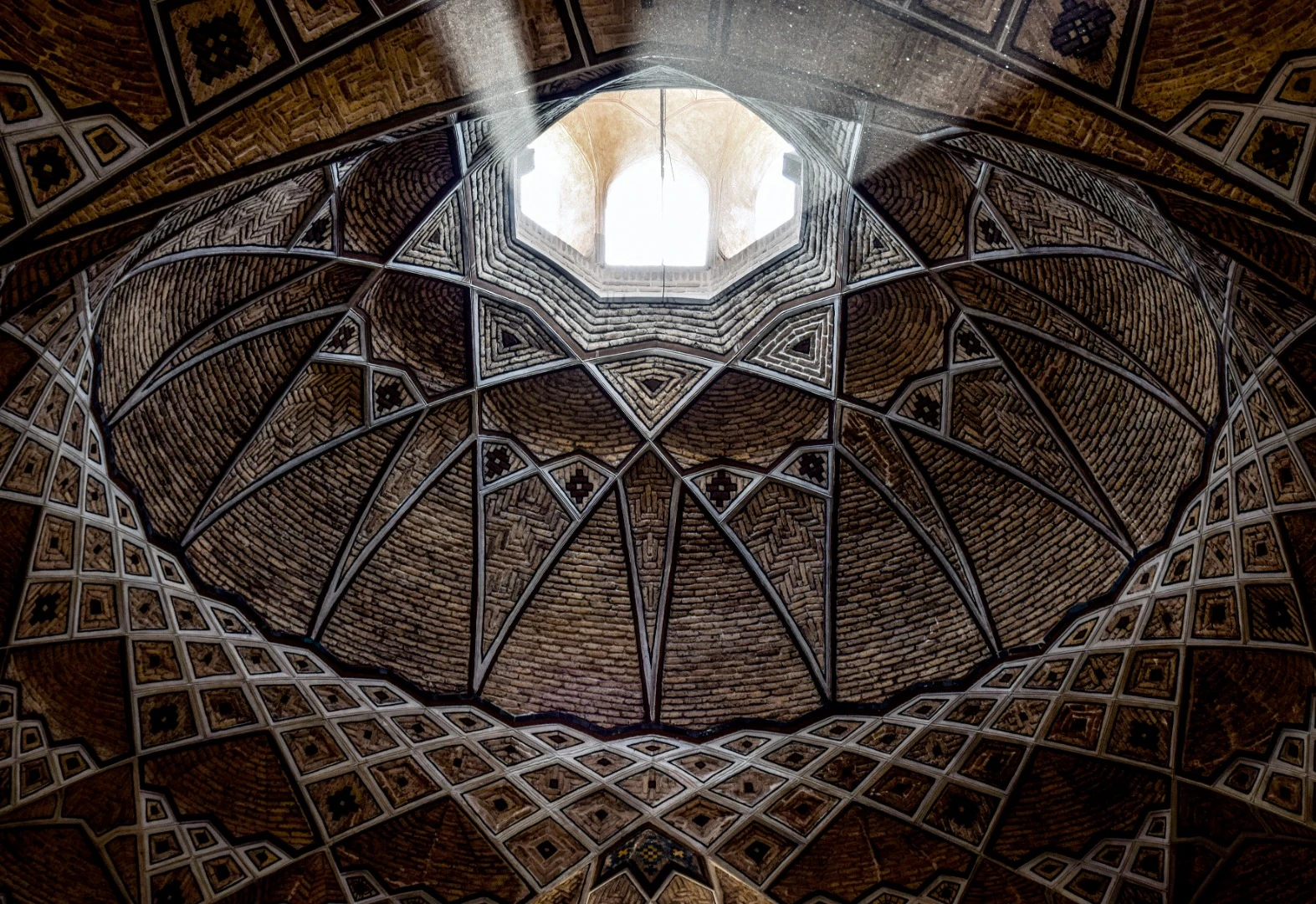 The intricate ceiling of a carpet market in Iran