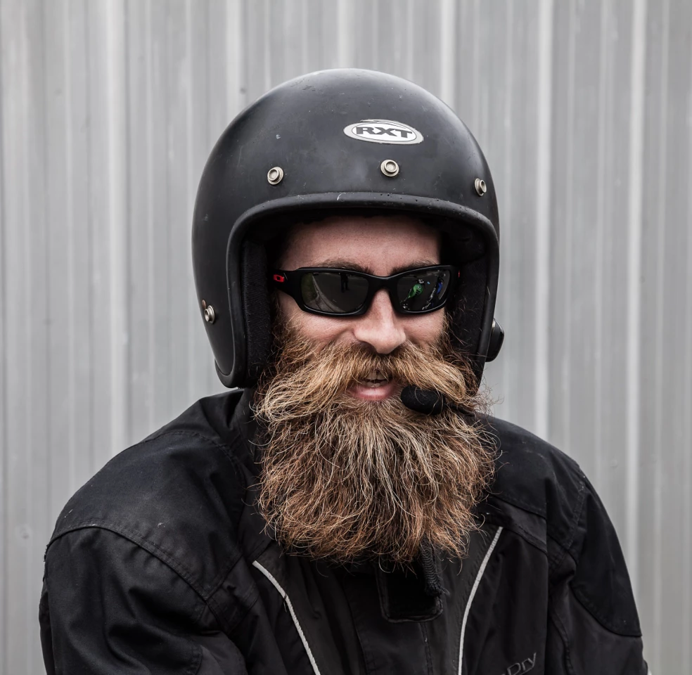 British natural beard, styled moustash champion Matt Brown enjoying the Sena SMH10 mounted on an RXT open-face helmet
