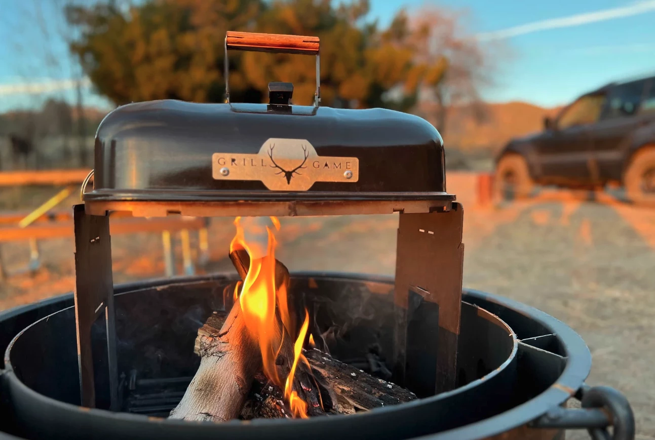 The Grill Game G1 works as an open campfire grill complete with heat-capturing lid