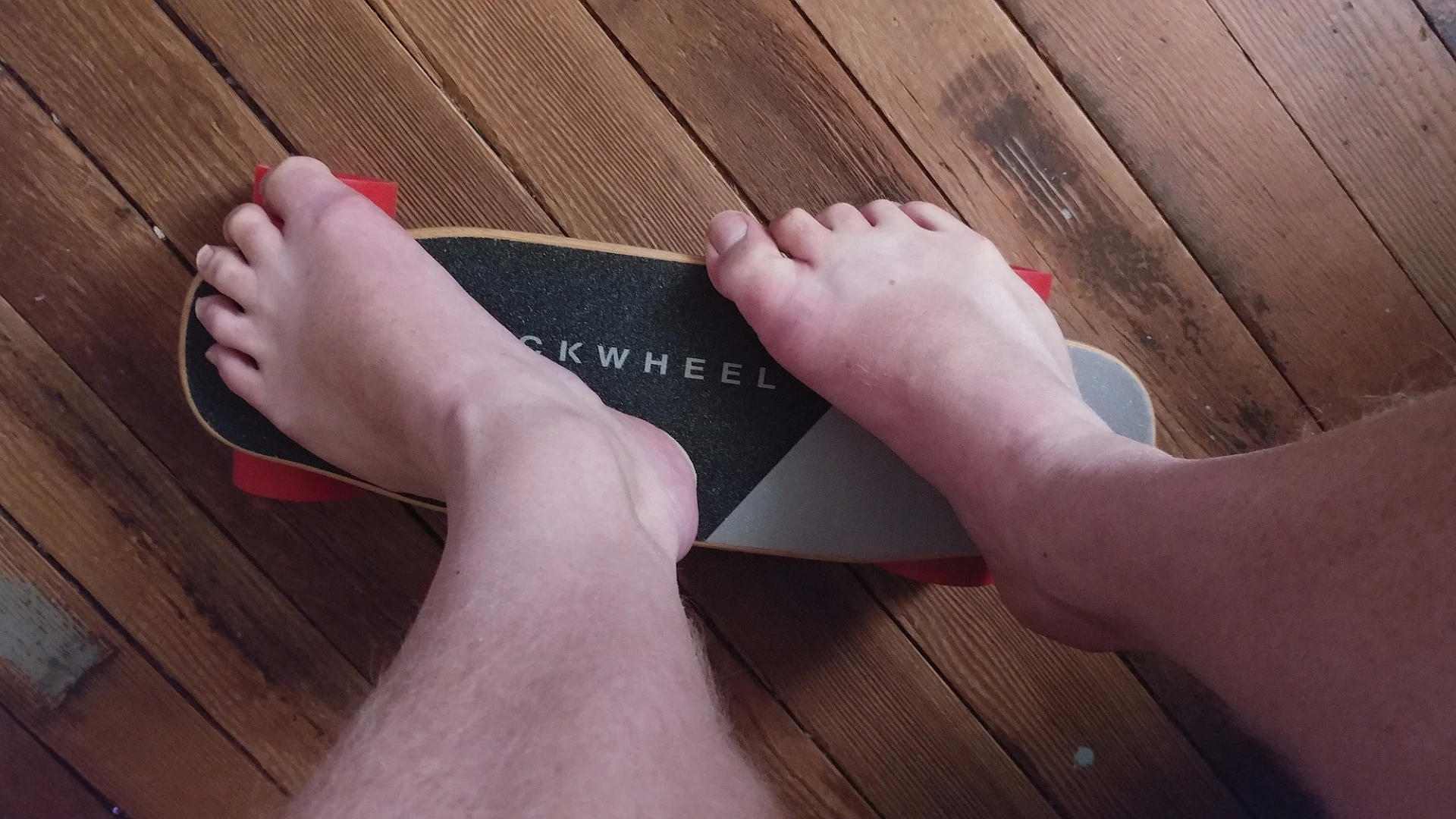 The author aspires to be a foot model someday. In the meantime, he proves that the Kuickwheel Serpent-C can be ridden indoors