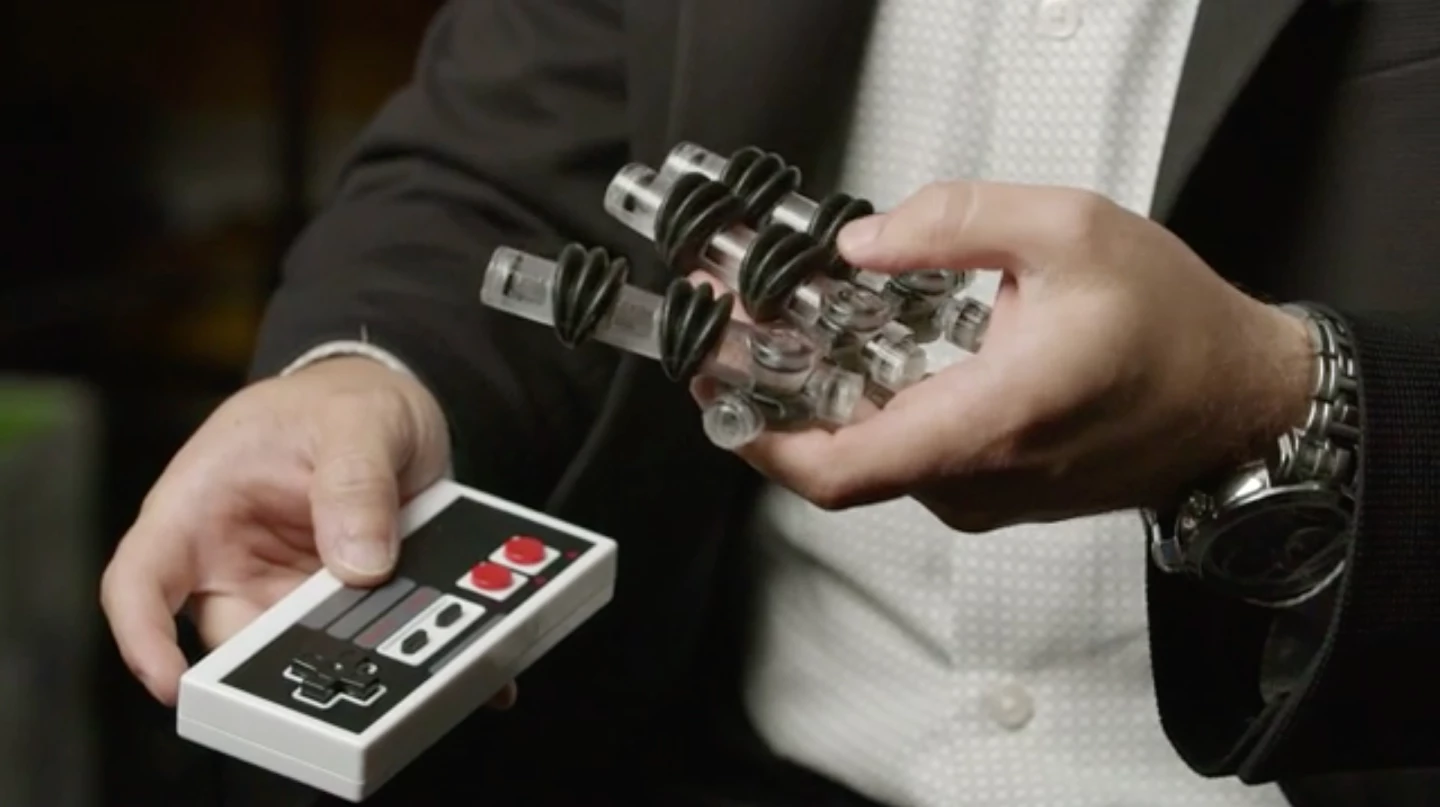 The soft robotic hand, with the fluidic transistors visible at the base of each finger