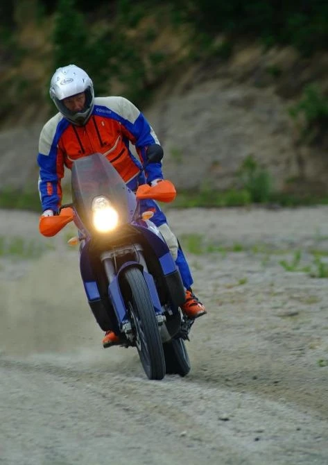 Don't try this at home - not many bikes are capable of getting happily sideways in the dirt and also carrying you across AfricaImage - T. Landrichinger