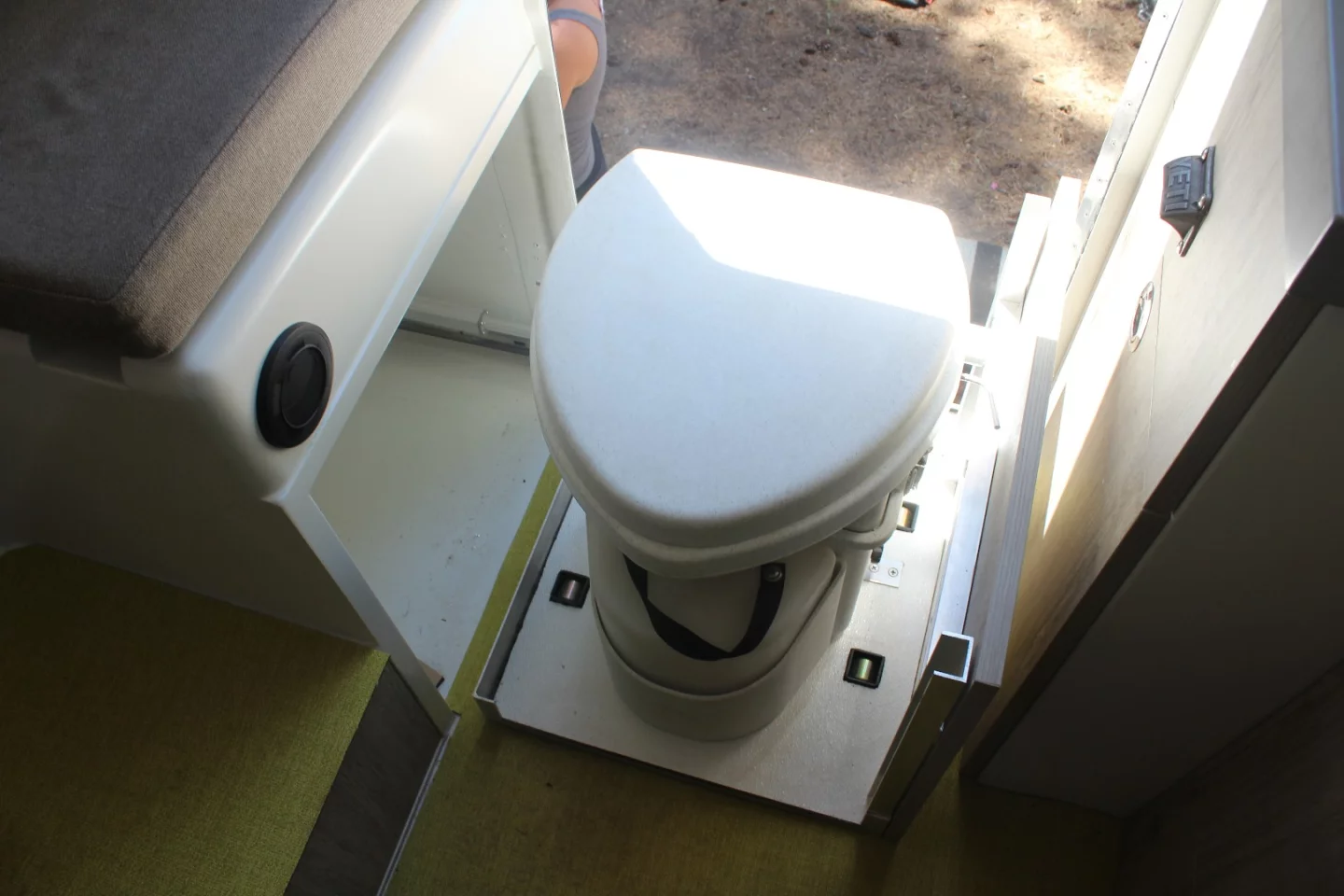 The Adrift toilet electrically slides out of a storage compartment just inside the entryway