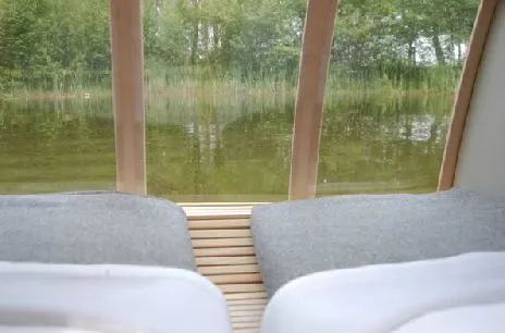 Large curved floor to ceiling windows allow guests to star gaze while being gently rocked to sleep