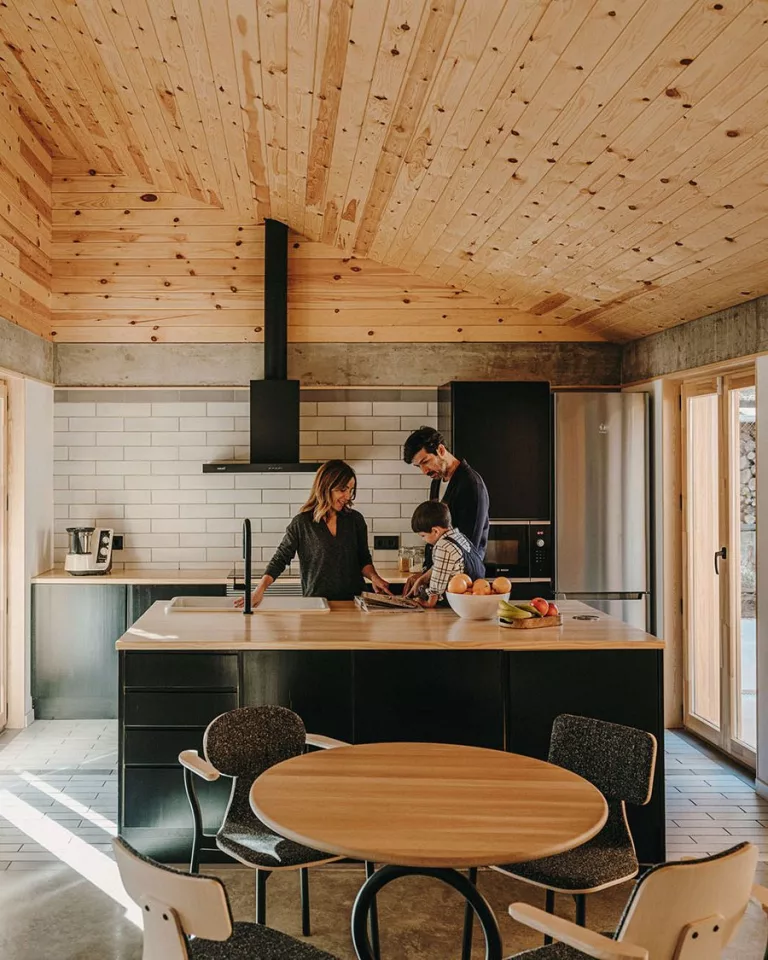 The interior of the home features a large modern kitchen with adjoining dining area